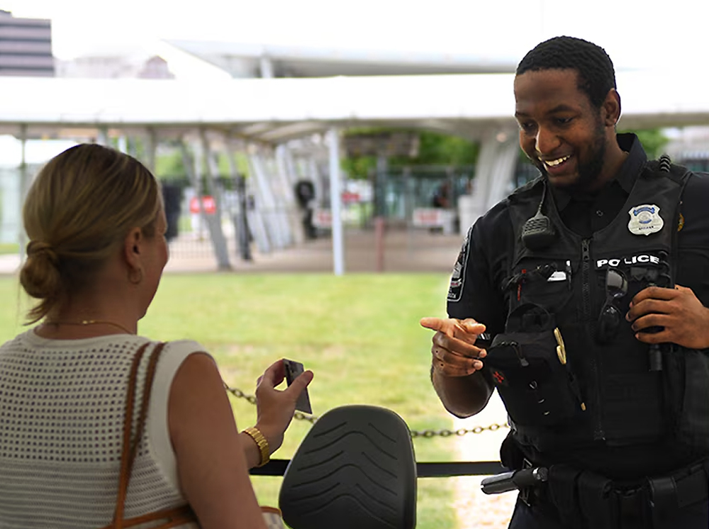 A Pentagon police officer verifies CAC card credentials, ensuring proper building access.